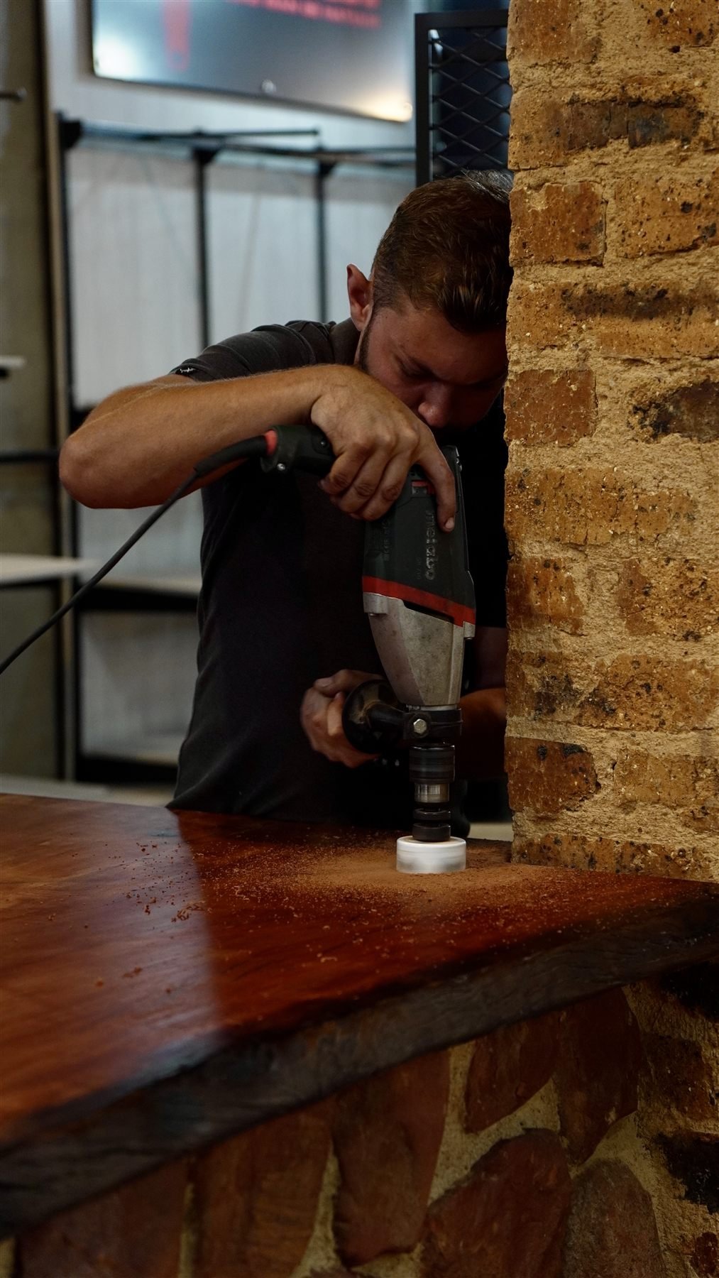 Duncan de Jager installing live edge countertop Gauteng — De Jager Wood Designs